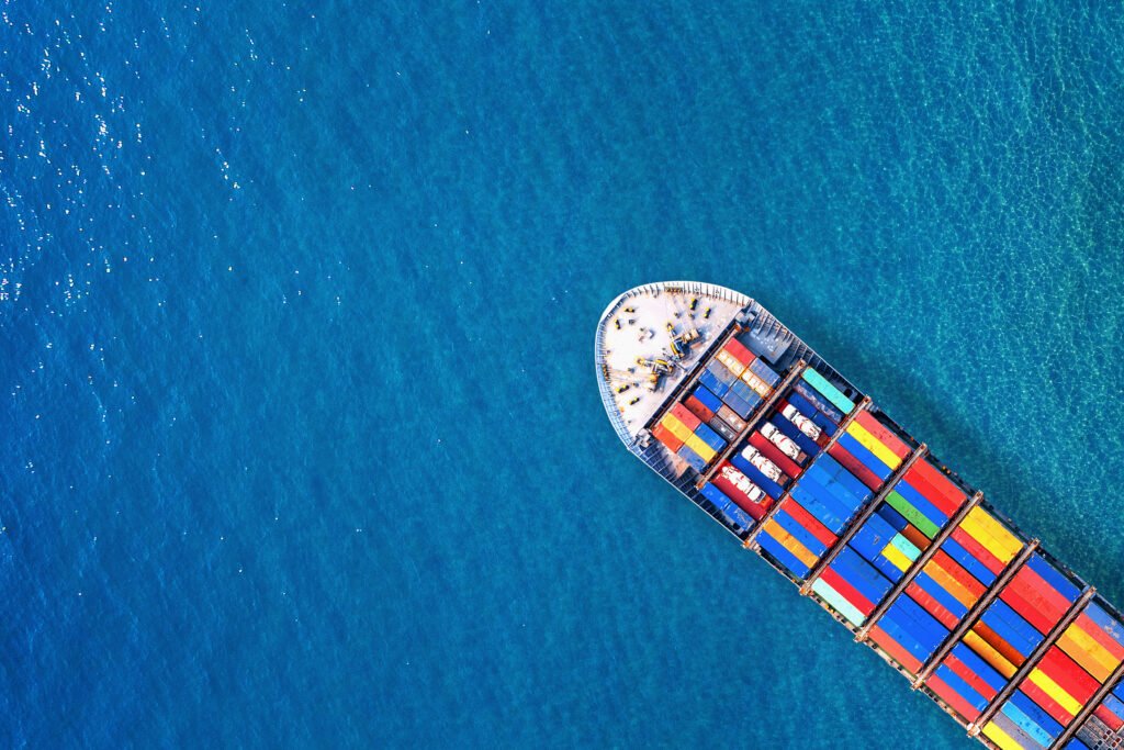 Aerial view of container cargo ship in sea.