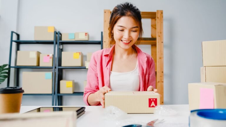 young-asia-entrepreneur-businesswoman-packing-product-cardboard-box-deliver-customer-working-home-office-small-business-owner-start-up-online-market-delivery-lifestyle-freelance-concept